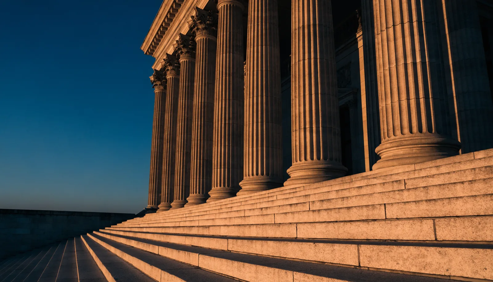 California courthouse steps and columns at golden hour, representing a second-chance path through PC 1000 drug diversion